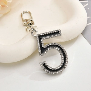 Sparkling silver number 5 keychain charm with pave crystals and black enamel inlay