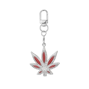 Silver leaf keychain pendant with red enamel filling and sparkling rhinestone inlay