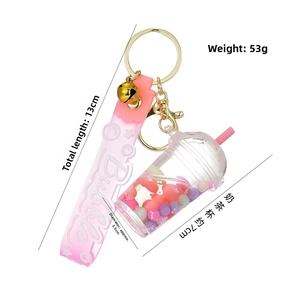 Detailed view of 13cm pink acrylic bubble tea keychain with liquid sequins and wristlet