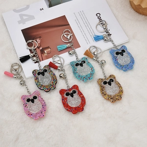 Sparkling rhinestone owl keychains with tassels in pink, blue, red and brown colors