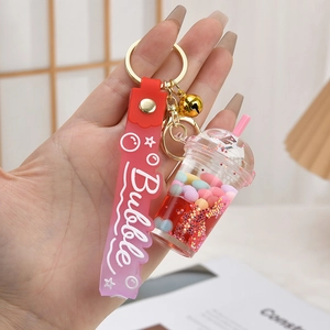 Pink bubble tea keychain with gradient silicone wristlet and liquid shaker charm