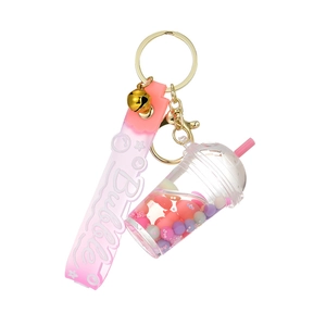 Acrylic bubble tea keychain with colorful beads in liquid and pink strap on white background