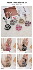 Detail of sparkling rhinestone bear paw keychains with matching tassels and charms