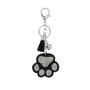 Sparkling rhinestone bear paw keychain with black tassel and silver bell accessory