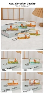 Detailed macro view of creative capybara liquid bus keychains with glitter and sequins