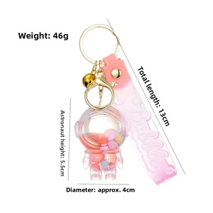 Detail showing dimensions of astronaut keychain with pink liquid and bubble strap