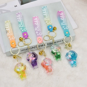 Astronaut liquid quicksand keychains in five candy colors with silicone straps