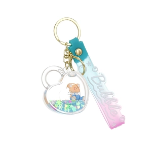 Creative heart liquid quicksand keychain with yellow bear and gradient PVC wrist strap