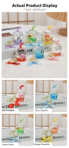 Detail of liquid quicksand keychain with cute ocean animals inside milk tea cups