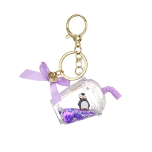 Purple bubble tea liquid keychain featuring a cute penguin and golden heart charm