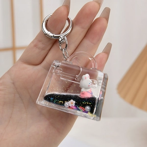 Cute bunny in handbag shaped acrylic keychain with black glitter quicksand and metal clasp