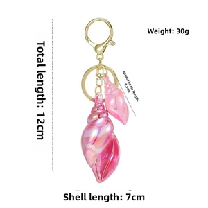 Detailed dimension guide for pink seashell keychains with golden hardware and hooks
