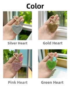 Detailed grid of crystal heart keychains in silver, gold, pink, and green colors