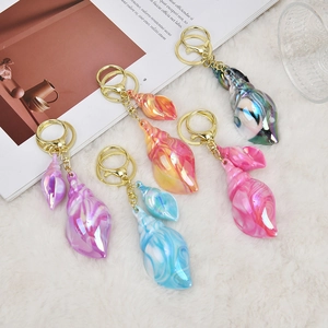Colorful shell keychains with iridescent finish and gold lobster clasp for bags