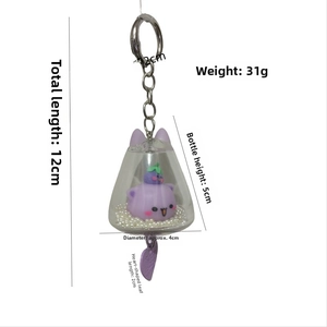 Detail view of acrylic purple cat keychain with liquid quicksand and heart pendant
