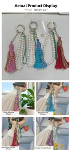 Detail of handmade colorful tassels with pearls and silver clips for bags and phones