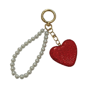 Red rhinestone heart keychain with elegant white pearls and a golden lobster clasp