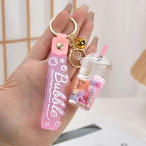 Cute bubble tea acrylic keychain with pink liquid sand and silicone strap decoration