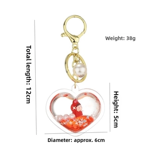Detail view of acrylic heart-shaped keychain with red liquid sand and dimensions