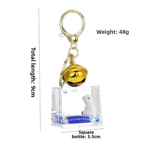 Vista dettagliata portachiavi liquido orso polare con misure 9cm lungo e 3,5cm flacone