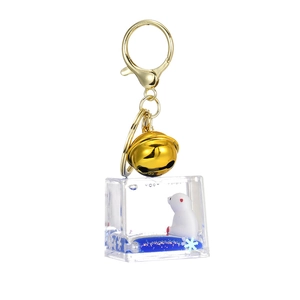Portachiavi con orso polare, liquido blu oceano e accessorio campanello dorato