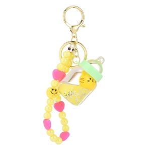 Creative floating liquid milk bottle keychain with cute yellow cat and beaded strap