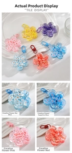 Macro shot of colorful floral acrylic liquid quicksand charms with vibrant sequins