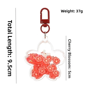 Detail of cherry blossom acrylic oil shaker keychain showing dimensions 5cm and 9.5cm length