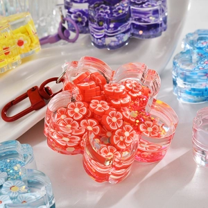 Luminous flower liquid quicksand keychain with red floral clay and metallic lobster clasp