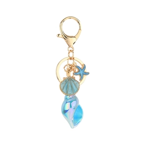Ocean theme keychain with blue shell, starfish, and conch charms on golden metal ring