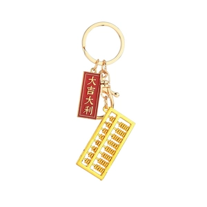 Portachiavi con abaco dorato e ciondolo portafortuna con anello in metallo lucido oro
