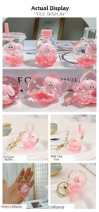 Detail of pink liquid glitter keychains featuring Cinnamoroll in acrylic bottles