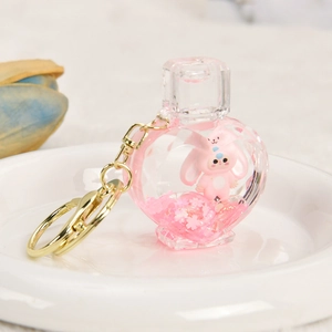 Pink heart-shaped liquid quicksand keychain with cute rabbit doll and cherry blossoms