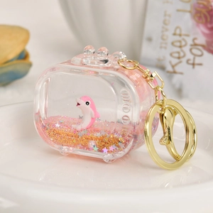 Retro TV-shaped acrylic keychain with pink dolphin, moving glitter, and gold lobster clasp