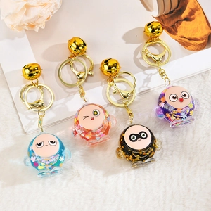 Cute egg-shaped quicksand keychains with colorful sequins and golden bells for bags