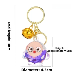Detail view of cartoon keychain with purple sequins, dimensions 10cm length and 40g weight