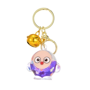 Cute cartoon quicksand keychain with purple glitter sequins and gold bell accessory