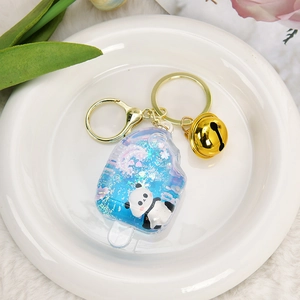 Porte-clés créatif panda en forme de glace avec sable mouvant bleu et cloche dorée