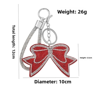 Detailed view of red rhinestone bow keychain with dimensions and silver lobster clasp