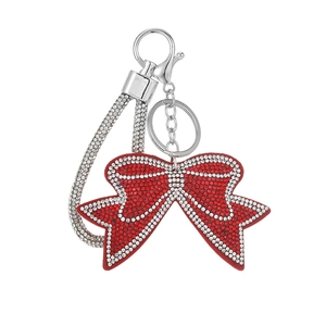 Red bowknot keychain with rhinestones and silver lobster clasp on white background