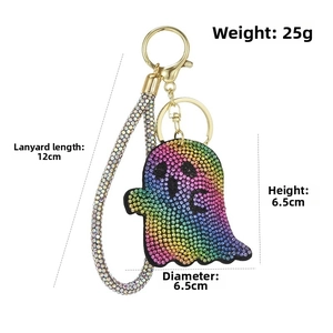 Detail of ghost keychain with rainbow rhinestones and golden hardware measurements