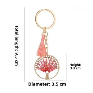 Detailed view of Tree of Life pendant with pink tassel and precise product dimensions