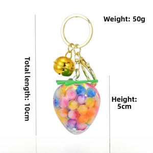 Detail view of strawberry resin keychain with dimensions 10cm length and 50g weight