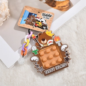 Detail of a brown teddy bear silicone pop-it keychain with colorful plastic chains