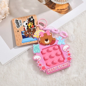 Pink Teddy Island silicone pop toy keychain with balloon dog and star detail close-up