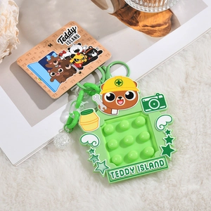 Teddy Island cartoon keychain with green silicone pop-it bear and colorful glitter ball