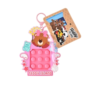 Teddy Island pink silicone Pop It keychain with brown bear and colorful star charms
