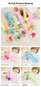 Detailed views of conch ocean liquid quicksand keychain with cute sea animal charms