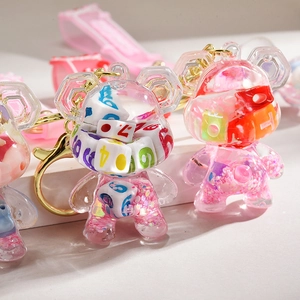 Cute pink liquid bear keychain with liquid sand and dice inside for bags and keys