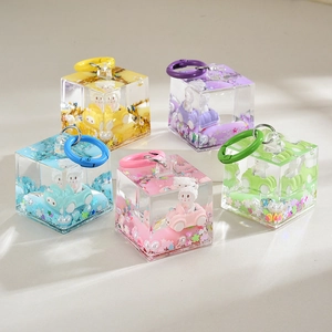 Five colorful acrylic cube keychains with cute bunny in car and star sequins